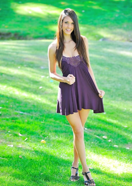 Delightful american brunette Tiffany Thompson in sexy skirt baring big tits and pussy outside